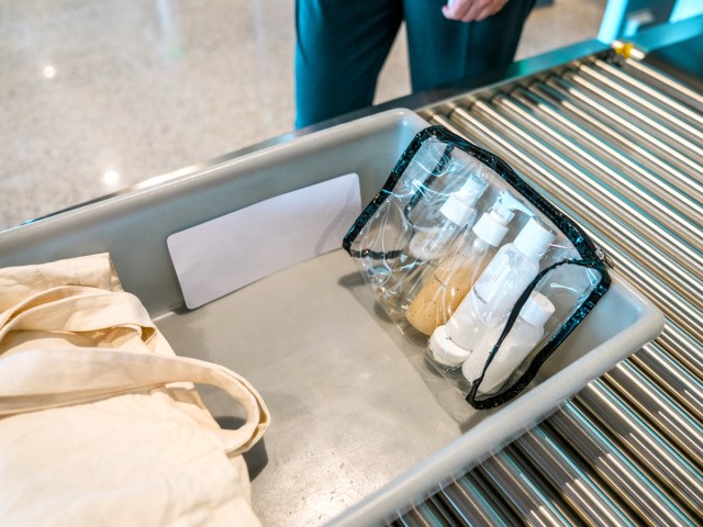 Toiletries in tray to be sent through X-ray scanner at TSA security checkpoint