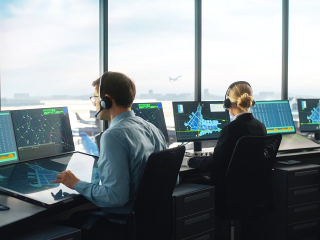 Air traffic controllers working in tower