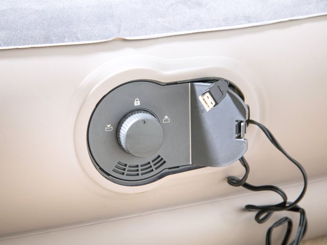 A close-up view of an air mattress pump