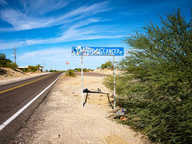 Roadside sign marking the Tropic of Cancer