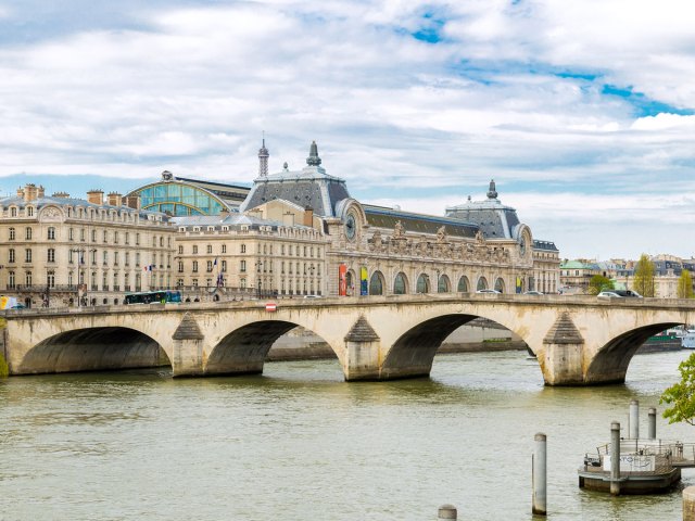 Musée d’Orsay in Paris, France, behind bridge across the Seine River