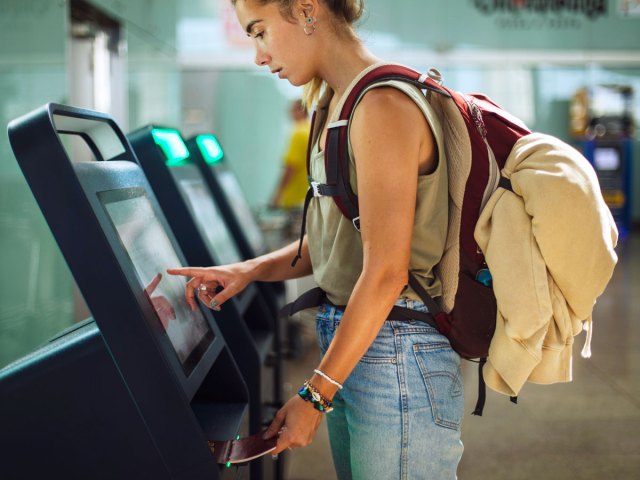 Traveler using electronic kiosk