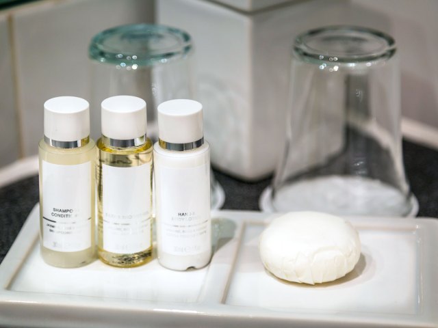 Single-use toiletry bottles on bathroom counter