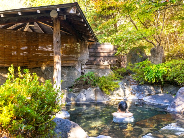 Person bathing in hot springs