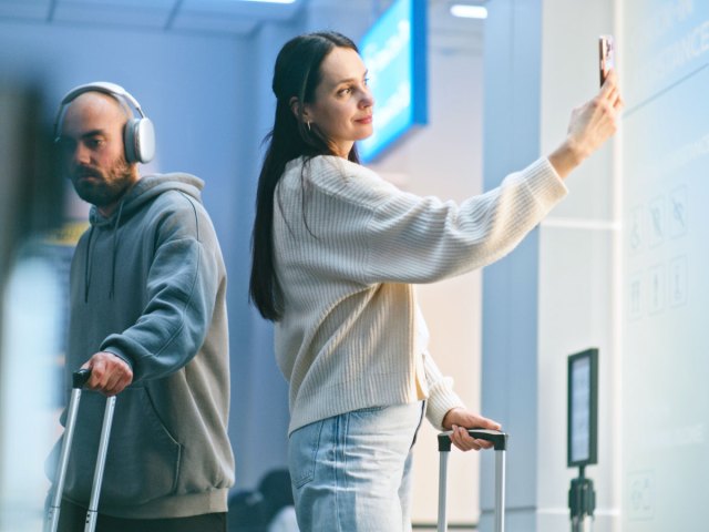 Traveler taking selfie at airport