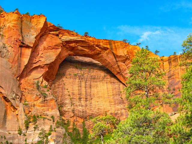 Kolob Arch against sandstone cliff in Utah's Zion National Park