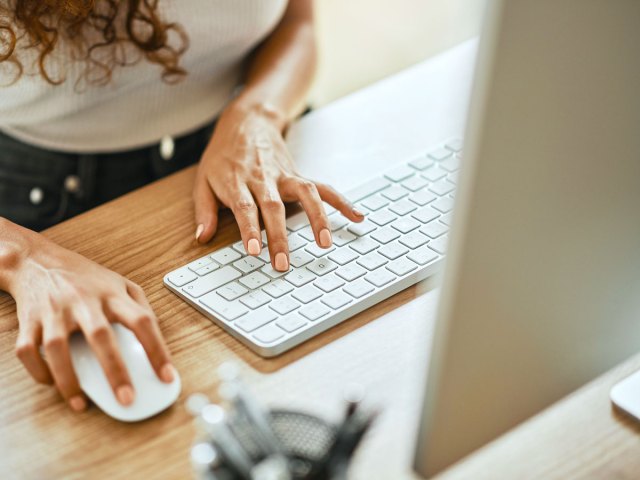 A person using a desktop computer