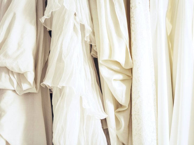 White dresses hanging on rack
