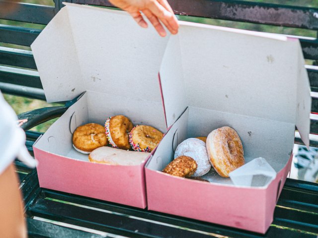 Pink boxes filled with doughnuts