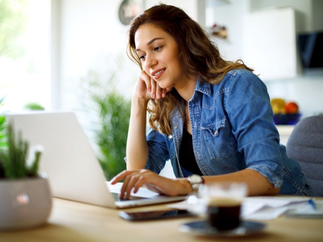 Woman typing on laptop computer