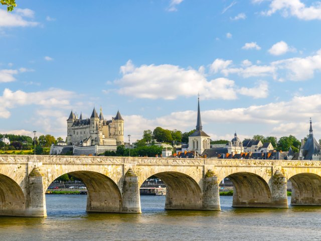 View of Chateau de Saumur beyond bridge in Saumur, France