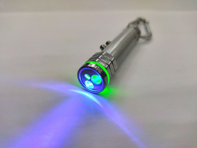 A laser pointer shining a purple color