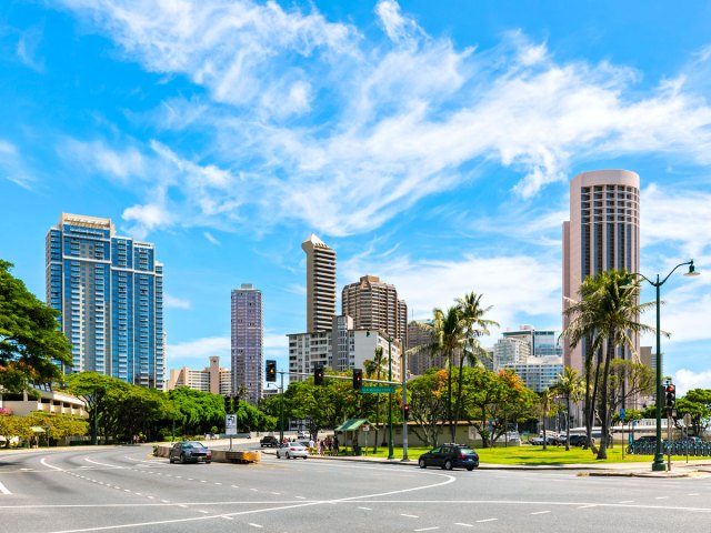 Street corner with palm trees in Honolulu, Hawaii