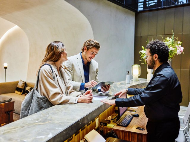 Guests at hotel check-in counter