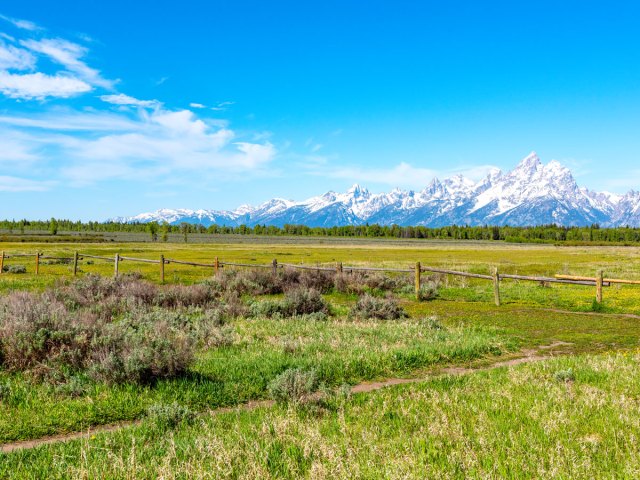 Grand Teton Mountains seen across ranch land in Wyoming
