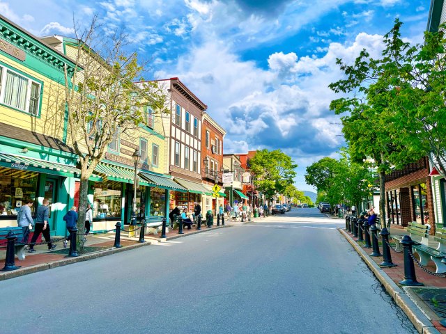 Pedestrians walking by shops in downtown Bar Harbor, Maine