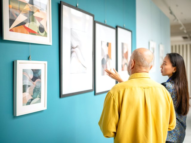 Museum patrons viewing paintings