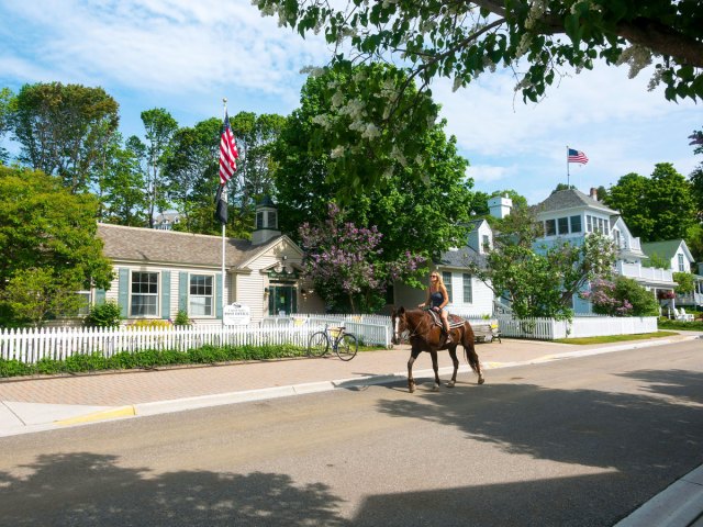Person riding horse on Mackinac Island, Michigan