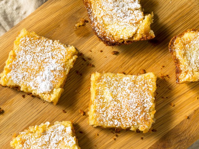 Slices of gooey butter cake on cutting board