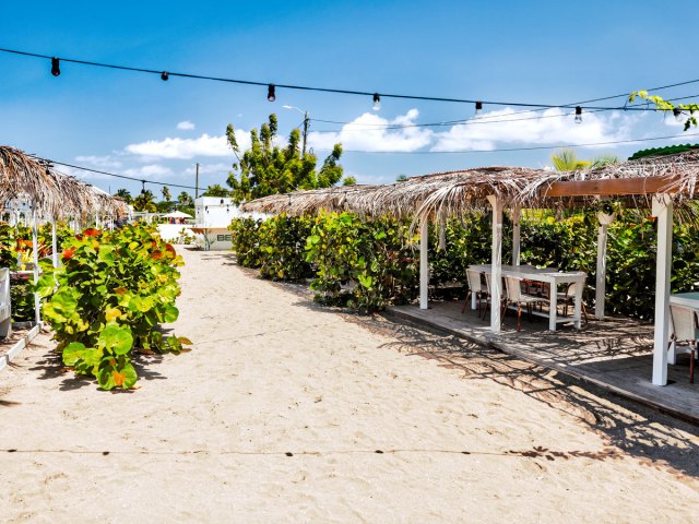 Dining tables on sandy beach in St. Kitts and Nevis