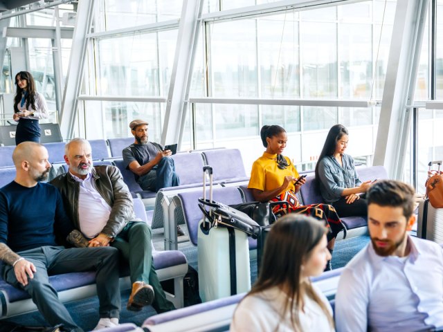 Passengers waiting at airport gate