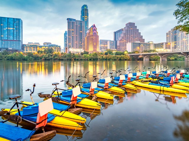 Water bicycles in lake with Austin skyline in background