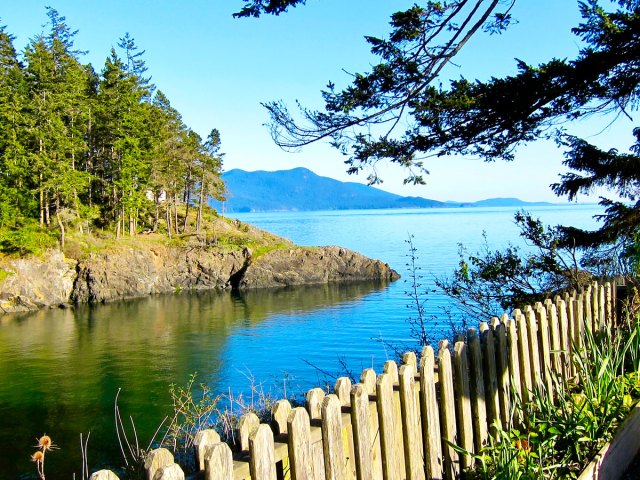Wooden fence along cove on Orcas Island, Washington