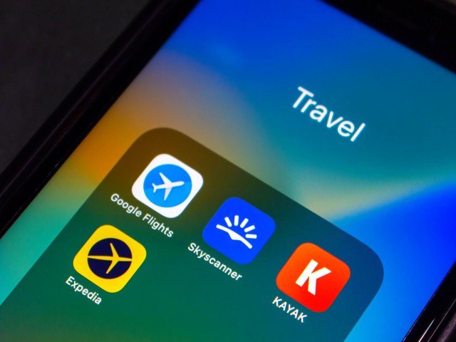 Close-up view of travel apps on cellphone