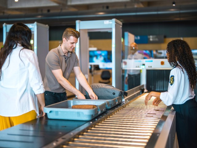 Passengers at airport security screening checkpoint