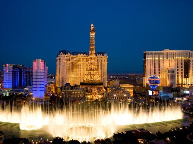 Fountains at Bellagio and Las Vegas Strip at night, seen from above