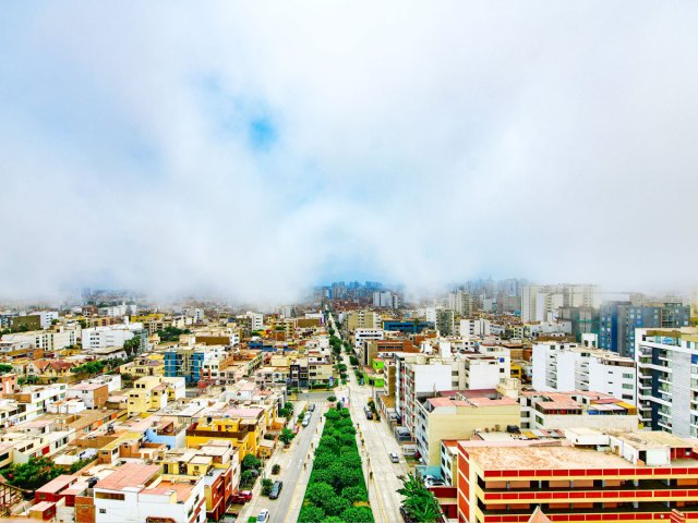 Aerial view of Lima, Peru, partially obscured by fog