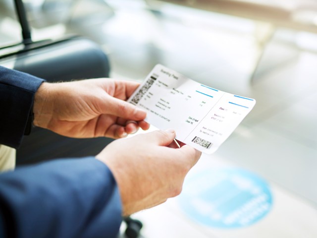 Passenger holding boarding pass