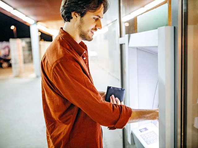 Man using ATM
