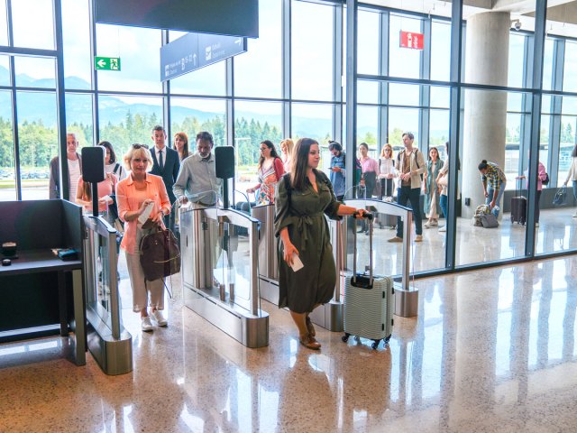 Passengers using electronic screening gates