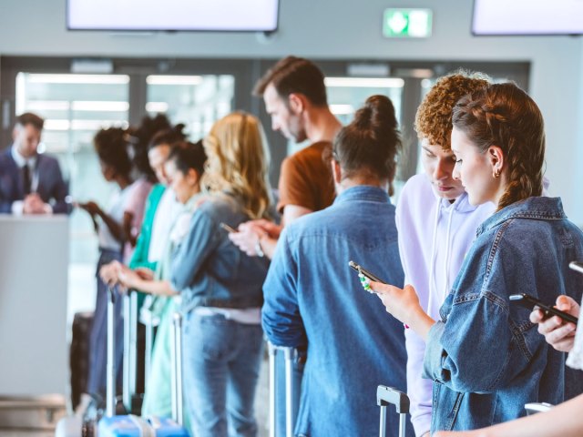Passengers lining up at gate to board
